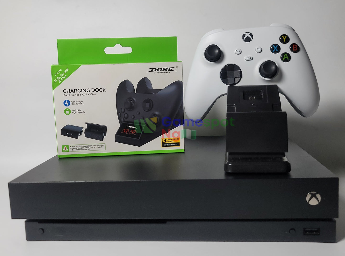 an Xbox One X 4KHDR+, 15 Installed Games + Rechargeable Dock & Battery(+ A wireless controller)